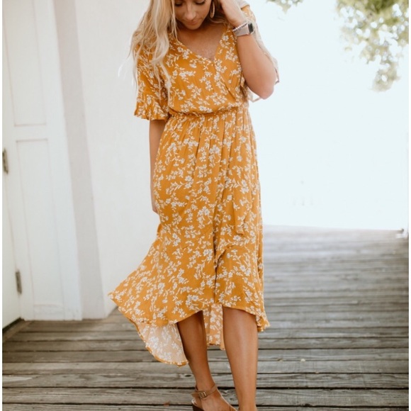 Kori Dresses & Skirts - Mustard floral high low faux wrap dress